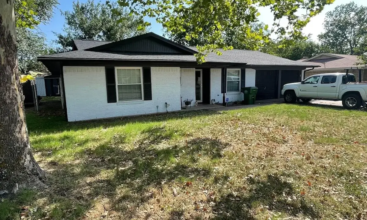 Professional roofing crew working on a residential roof in Superior
